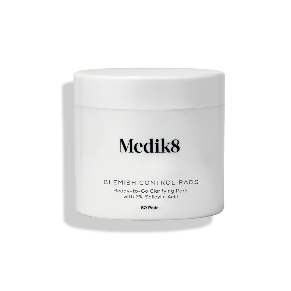 Medik8 Blemish Control Pads jar stands against a clean white background. Text identifies the product as  Ready-to-Go Clarifying Pads with 2% Salicylic Acid  containing 60 pads.