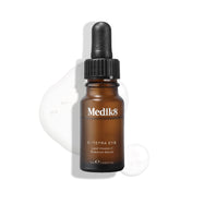 Medik8 C-Tetra Eye Lipid Vitamin C Radiance Serum bottle displayed on a white background with translucent serum droplets, highlighting its liquid texture.