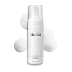 Medik8 Calmwise Soothing Cleanser pump bottle displayed on a white background with a smear of white foam behind it, highlighting the product's texture.