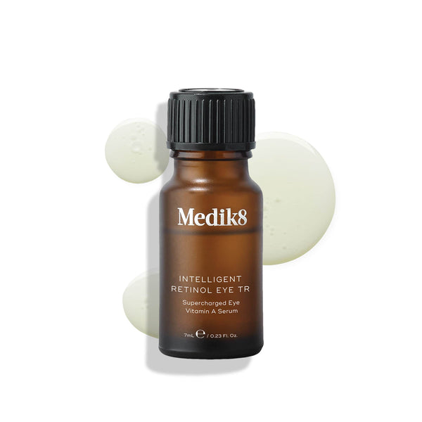 A bottle of Medik8 Intelligent Retinol Eye TR serum with a black cap on a plain background.