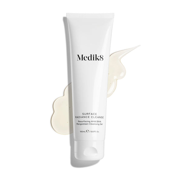Medik8 Surface Radiance Cleanse tube displayed on a clean white background with a large, translucent gel texture smear. Text identifies it as a Resurfacing AHA/BHA Mangosteen Cleansing Gel in a 150mL size.-10