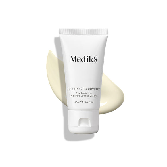 Medik8 Ultimate Recovery Skin Restoring Moisture Locking Cream tube displayed on a white background with a large, creamy swatch of the product visible behind it.-11