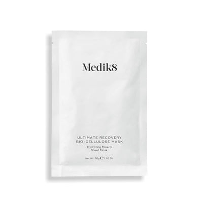 A single white sachet of Medik8 Ultimate Recovery Bio-Cellulose Mask displayed flat against a clean white background with a subtle shadow. Text labels it as a "Hydrating Mineral Sheet Mask."