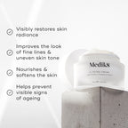 Medik8 C-Tetra Cream jar displayed on a grey stone block against a white background with soft light rays. The image features four check-marked claims:

Visibly restores skin radiance

Improves the look of fine lines & uneven skin tone

Nourishes & softens the skin

Helps prevent visible signs of ageing