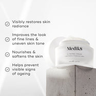 Medik8 C-Tetra Cream jar displayed on a grey stone block against a white background with soft light rays. The image features four check-marked claims:

Visibly restores skin radiance

Improves the look of fine lines & uneven skin tone

Nourishes & softens the skin

Helps prevent visible signs of ageing
