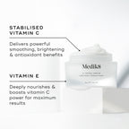 Medik8 C-Tetra Cream jar displayed open on a white stone block against a clean white background. The image features two key ingredients and their benefits:

STABILISED VITAMIN C: Delivers powerful smoothing, brightening, and antioxidant benefits.

VITAMIN E: Deeply nourishes and boosts vitamin C power for maximum results.