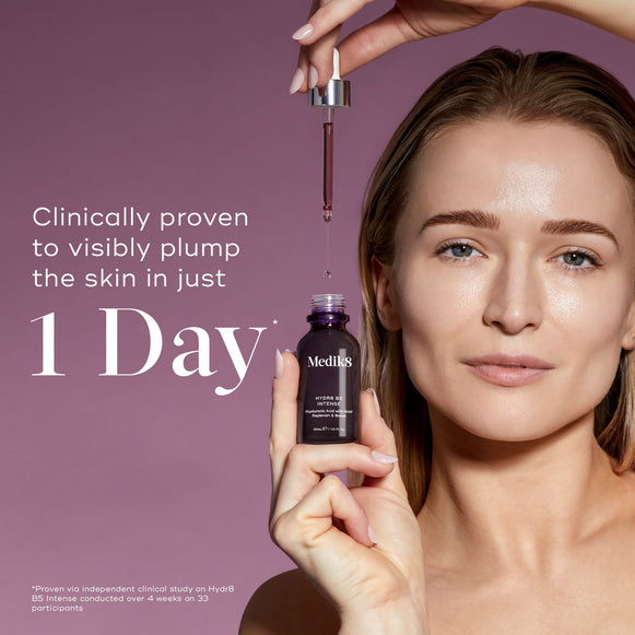 Medik8 Hydr8 B5 Intense glass dropper bottle centered on a shimmering purple background with translucent water droplets. Bold text states the product is clinically proven to visibly plump the skin in just 1 Day.-hover-20