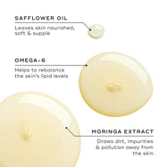 Three oil droplets display key ingredients. Text highlights Safflower Oil for nourishment, Omega-6 for lipid balance, and Moringa Extract for drawing out impurities and pollution.
