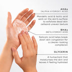 Close-up of hands lathering a light foam, highlighting key ingredients for Medik8 Surface Radiance Cleanse. Text describes AHAs (Mandelic and Lactic acid) for surface exfoliation, BHAs (Salicylic acid) to break down congestion, and Glycerin to moisturise and hydrate.