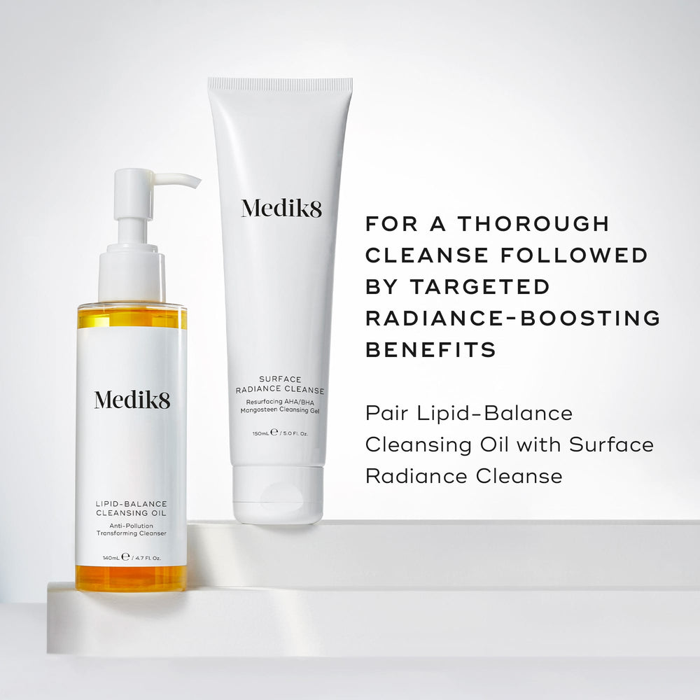 Lipid-Balance Cleansing Oil bottle stands beside a tube of Surface Radiance Cleanse. Text recommends pairing the two for a  thorough cleanse followed by targeted radiance-boosting benefits .