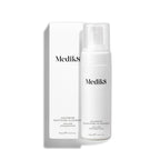 Medik8 Calmwise Soothing Cleanser pump bottle standing next to its white packaging box on a white background. Text identifies it as an  Ultra-Mild Chlorophyll Foam. 