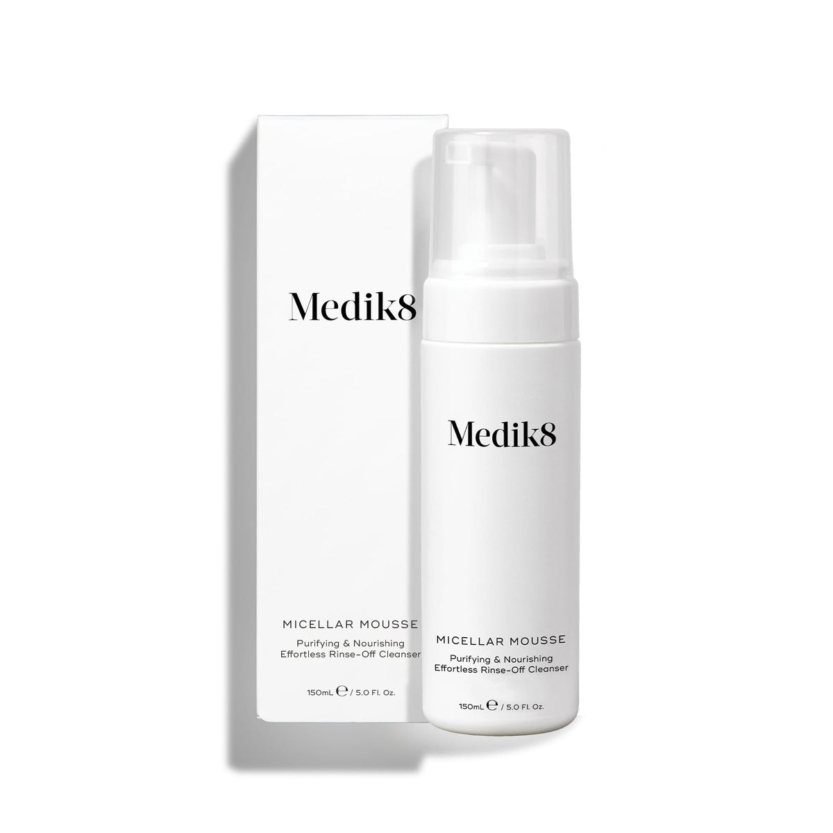 Medik8 Micellar Mousse pump bottle standing next to its white packaging box on a white background. Text identifies it as a Purifying & Nourishing Effortless Rinse-Off Cleanser. 