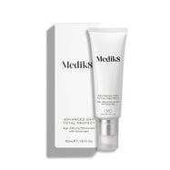 Medik8 Advanced Day Total Protect tube stands on a clean white background with a matching white outer carton. Text identifies the product as a 50mL Age-Defying Moisturiser with SPF 30 and 5* UVA protection.