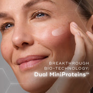  A woman is shown applying liquid peptides advanced MP to  the cheek. Text overlays the image, highlighting  BREAKTHROUGH BIO-TECHNOLOGY: Dual MiniProteins™.