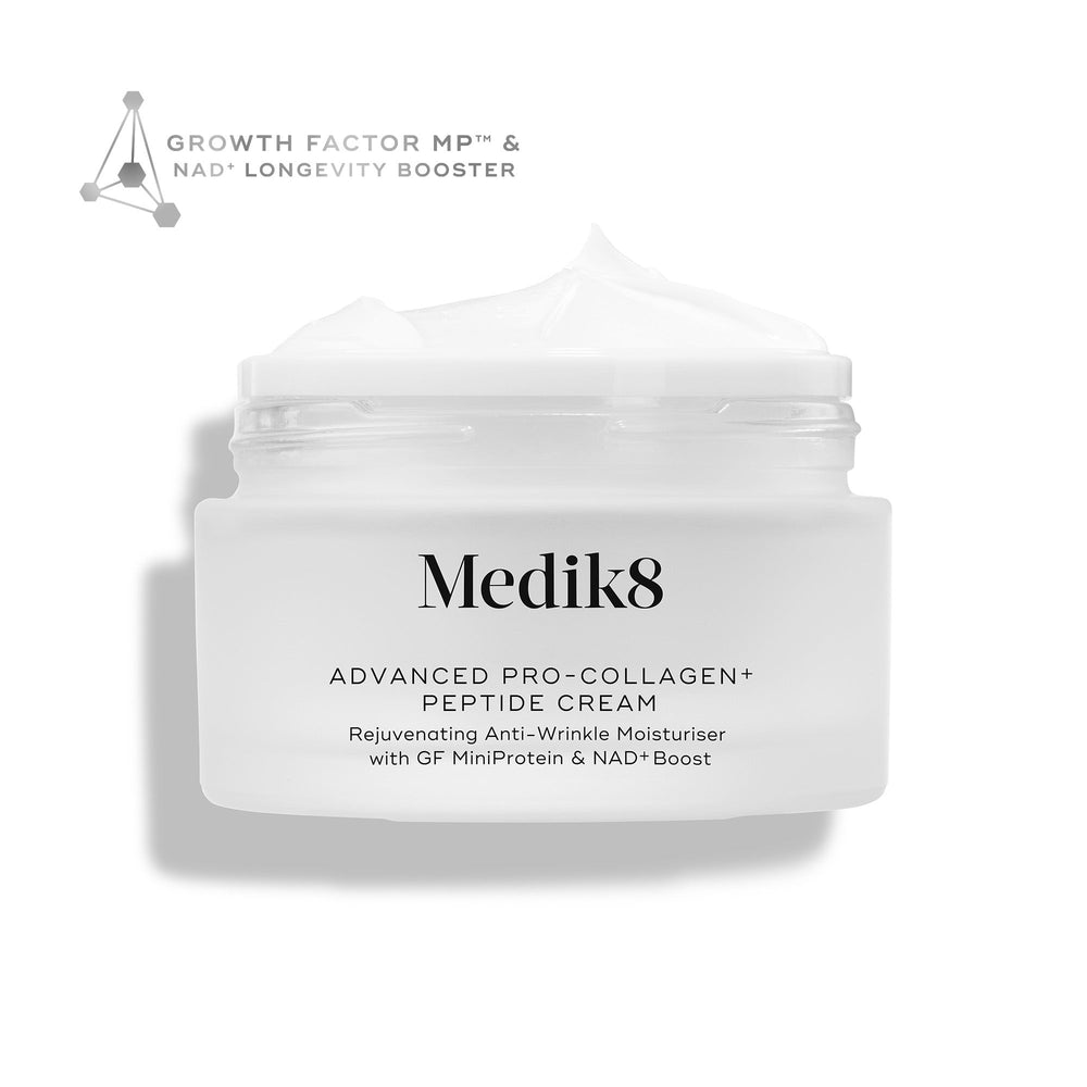 Medik8 Advanced Pro-Collagen+ Peptide Cream jar stands against a clean white background, with the open top revealing a rich white cream texture. Text on the jar highlights "Rejuvenating Anti-Wrinkle Moisturiser with GF MiniProtein & NAD+ Boost," while a geometric graphic in the corner reads "Growth Factor MP™ & NAD+ Longevity Booster."