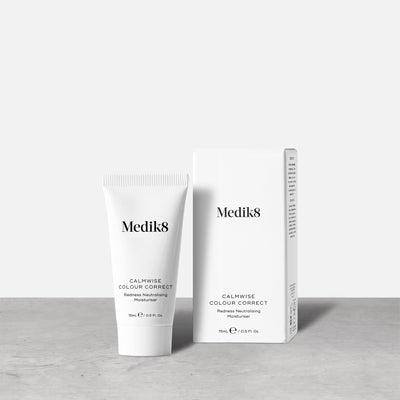 A small white tube of Calmwise Colour Correct (15mL) stands beside its white carton