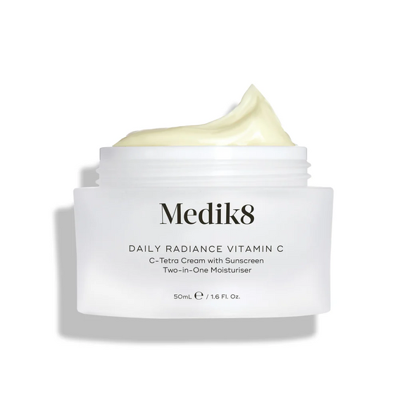 Medik8 Daily Radiance Vitamin C cream jar is shown open with a generous peak of pale yellow cream on top. Text identifies the product as a 50mL C-Tetra Cream Two-in-One Moisturiser.-12