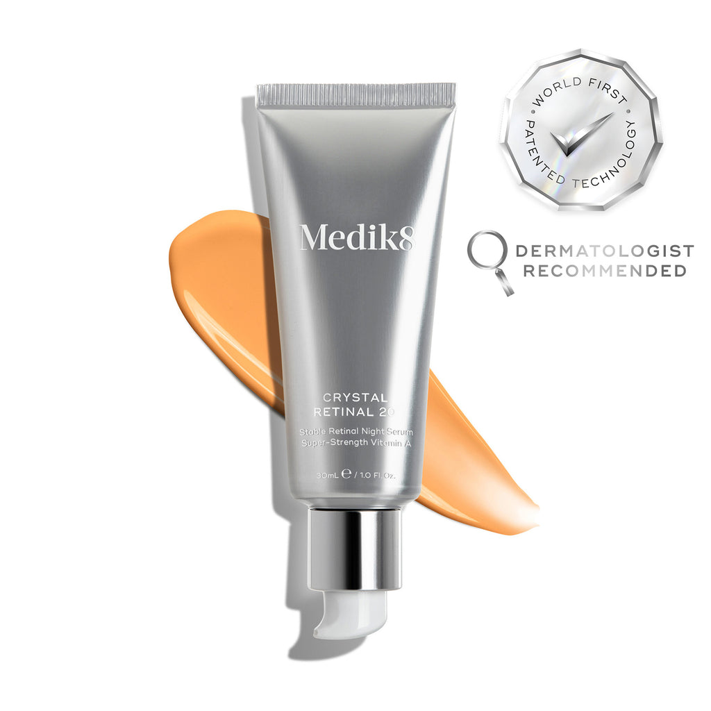 A silver tube of Crystal Retinal 20 is displayed, with an orange swatch. A WORLD FIRST PATENTED TECHNOLOGY seal and a DERMATOLOGIST RECOMMENDED icon are shown. 