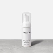 A bottle of Medik8 Gentle Cleanse Hydrating Rosemary Foam (40ml) stands on a grey surface against a white background. It is a white bottle with a clear cap and a white foam pump. Label text includes: Medik8, GENTLE CLEANSE, Hydrating, Rosemary Foam.