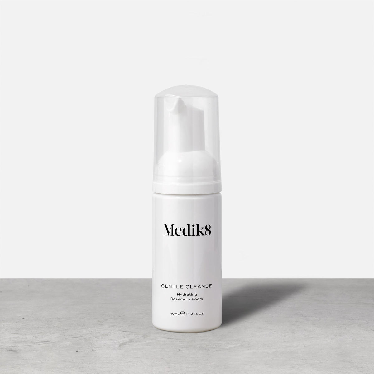 A bottle of Medik8 Gentle Cleanse Hydrating Rosemary Foam (40ml) stands on a grey surface against a white background. It is a white bottle with a clear cap and a white foam pump. Label text includes: Medik8, GENTLE CLEANSE, Hydrating, Rosemary Foam.