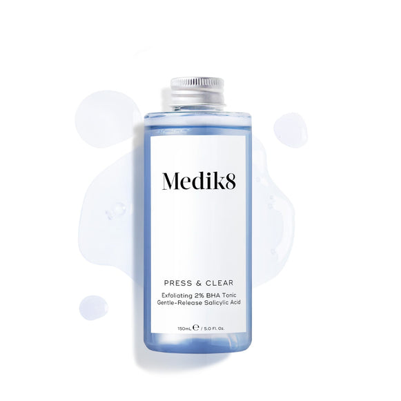 A refill bottle (150ml) of Medik8 Press & Clear tonic with a silver screw cap, displayed on a white background with blue liquid droplets. Text confirms it contains  Gentle-Release Salicylic Acid. -6