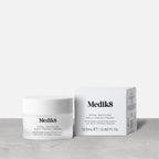 A jar of Medik8 Total Moisture Daily Facial Cream. The jar stands in front of its white cardboard carton on a light background. Text on both reads: "AM/PM Multi-Layered Moisturisation with H.E.O.® & Prebiotic Peptides."