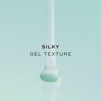 Silky gel texture. The animation shows a thick, translucent teal gel pouring down into a smooth pool.
