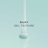 Silky gel texture. The animation shows a thick, translucent teal gel pouring down into a smooth pool.