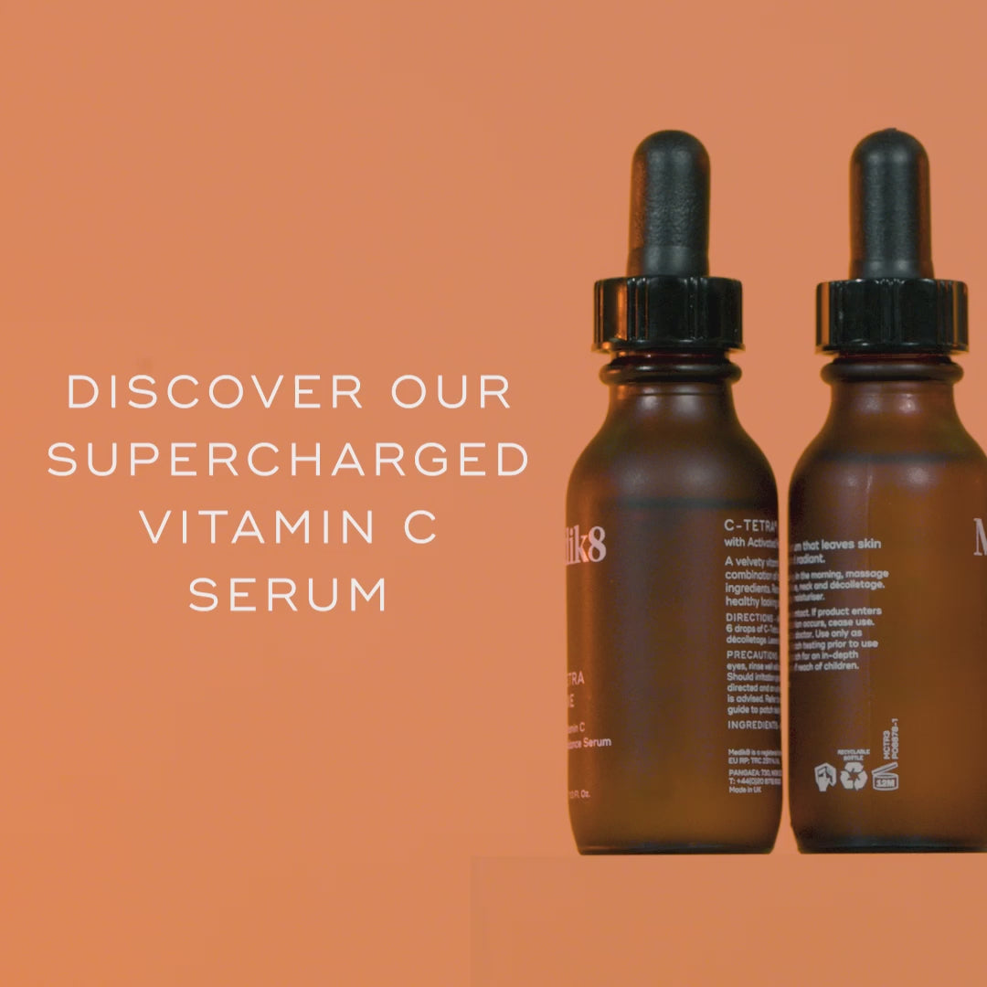 Promotional video for Medik8 C-Tetra Luxe serum showing a mature woman smiling and applying the product. Text highlights it has "2X MORE VITAMIN C" than the original C-Tetra and is clinically proven to instantly boost radiance while visibly reducing wrinkles and dark spots. Ingredients listed include 14% Tetrahexyldecyl Ascorbate, Squalane, Maracuja Oil, and Red Ginseng. Instructions advise morning application followed by sunscreen.